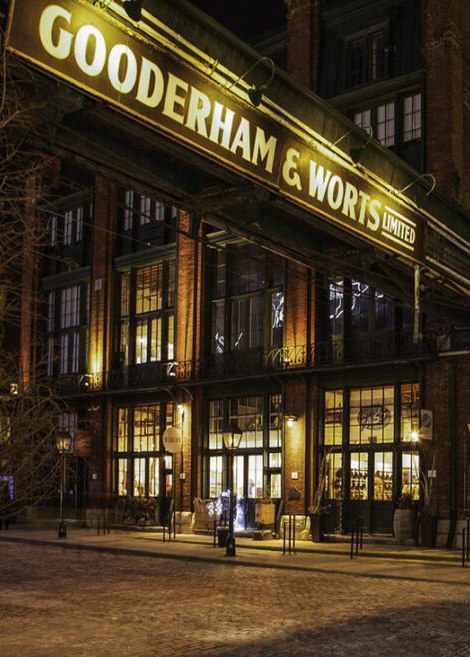 Exterior of Collège Boréal at night, with lights.